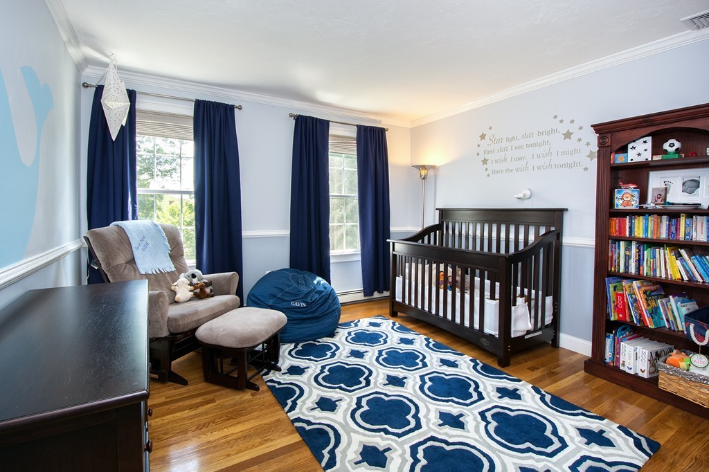 123 Tilden Road Scituate, MA 02066 - Photo 17 of 27 a bedroom with furniture and a book shelf