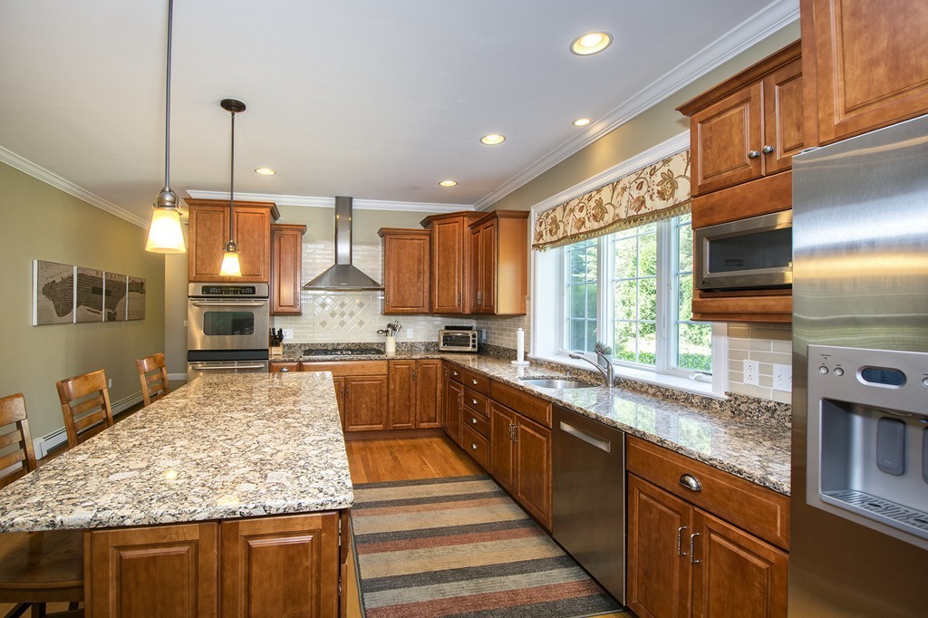123 Tilden Road Scituate, MA 02066 - Photo 3 of 27 a kitchen with stainless steel appliances granite countertop a sink stove and refrigerator