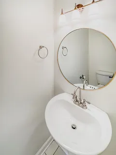 a bathroom with a sink and mirror