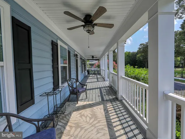 a view of a porch with wooden floor and outdoor space