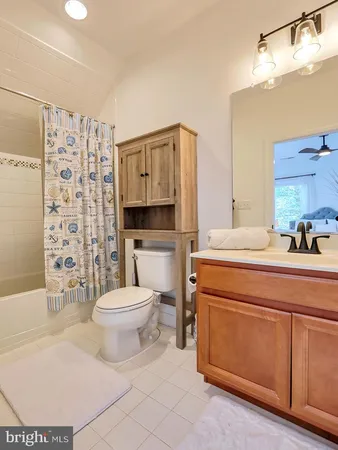 a bathroom with a toilet a sink and a shower