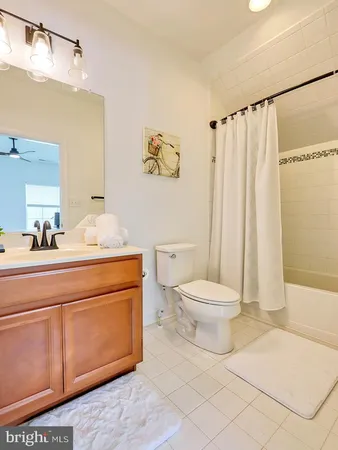 a bathroom with a toilet a sink and a shower