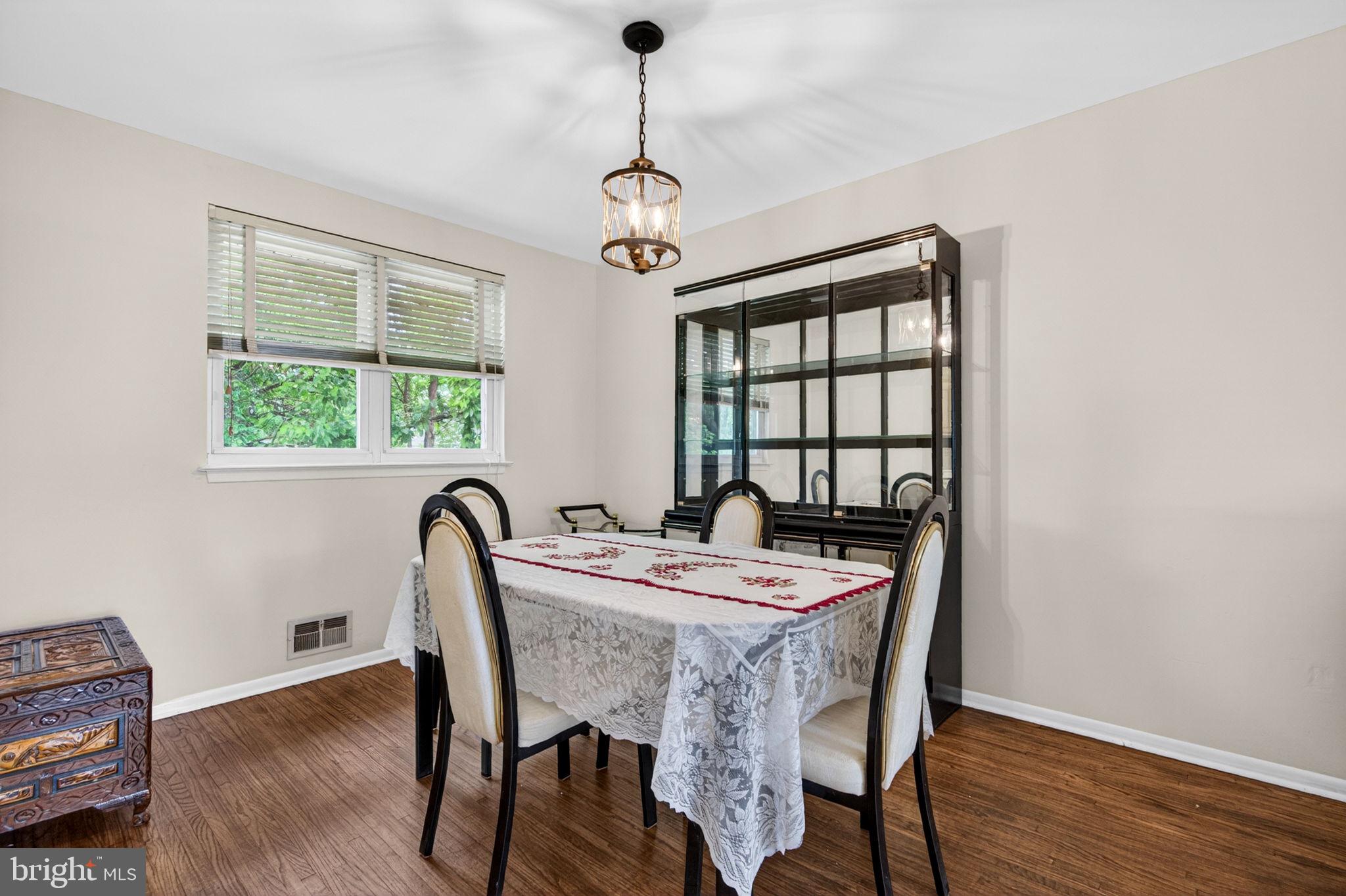 46 Trinity Avenue Marlton, NJ 08053 - Photo 9 of 37 a dining room with furniture a chandelier and wooden floor