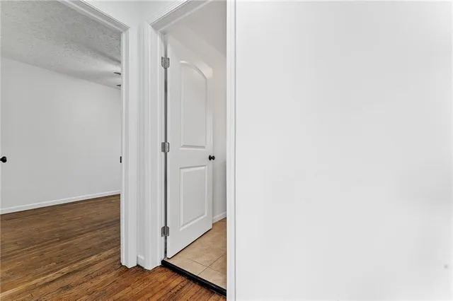 a view of a bathroom with wooden floor