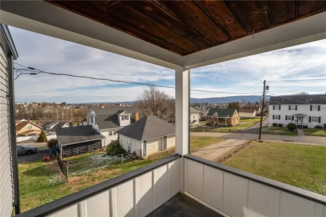 a view of a living room and floor to ceiling window