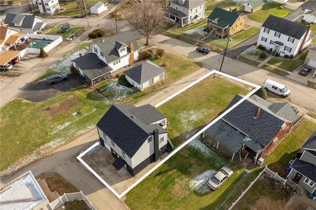 an aerial view of residential house with outdoor space