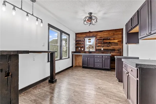 a kitchen with stainless steel appliances a stove a refrigerator and cabinets