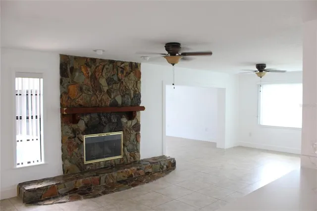 an empty room with a fireplace