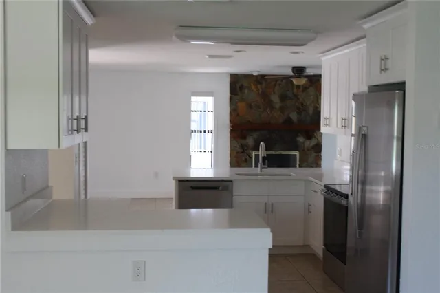a bathroom with a bathtub and a window
