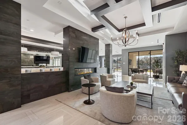 a living room with furniture and flat screen tv