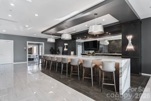 a group of chairs sitting in kitchen and dining room