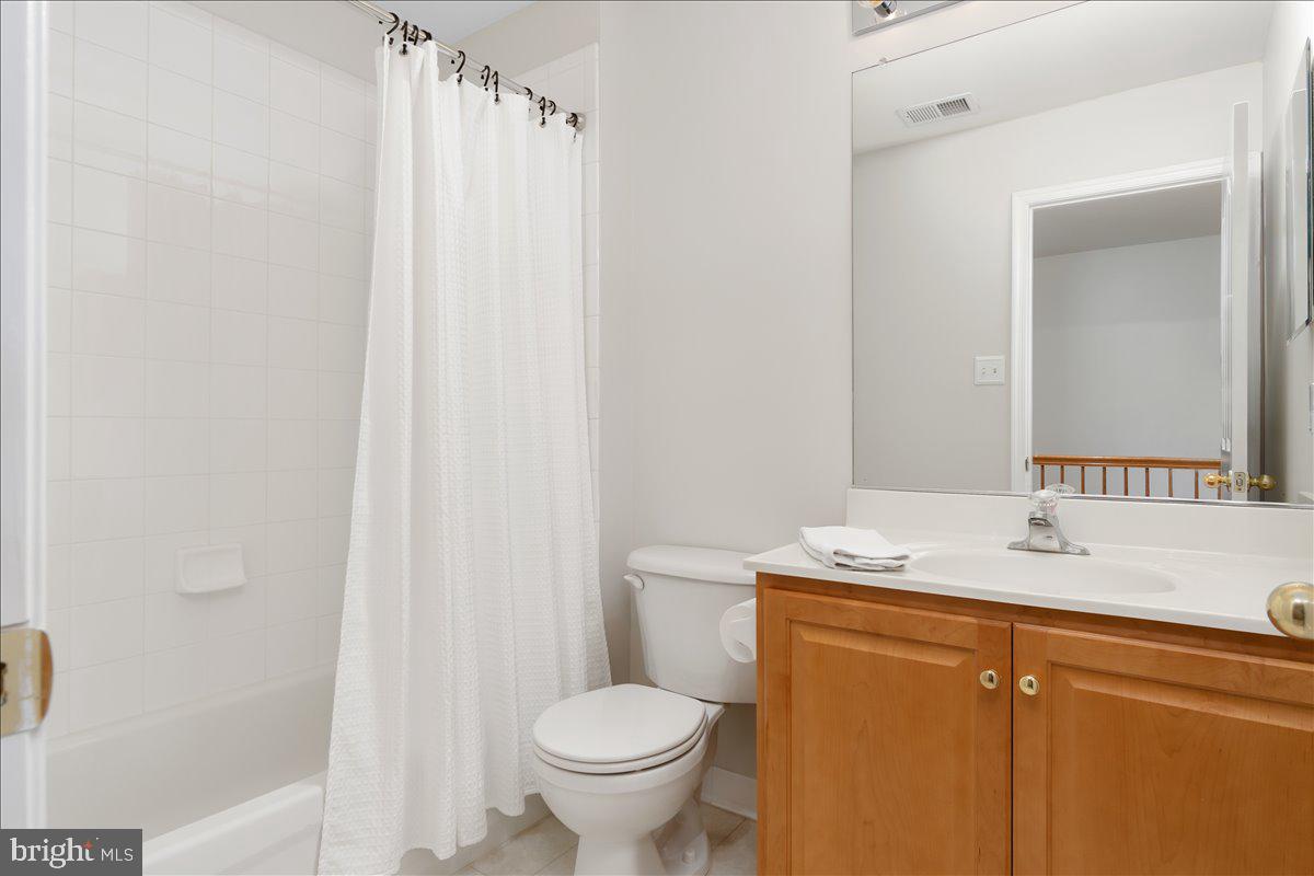 2003 Buell Drive Frederick, MD 21702 - Photo 15 of 32 a bathroom with a granite countertop sink toilet and shower