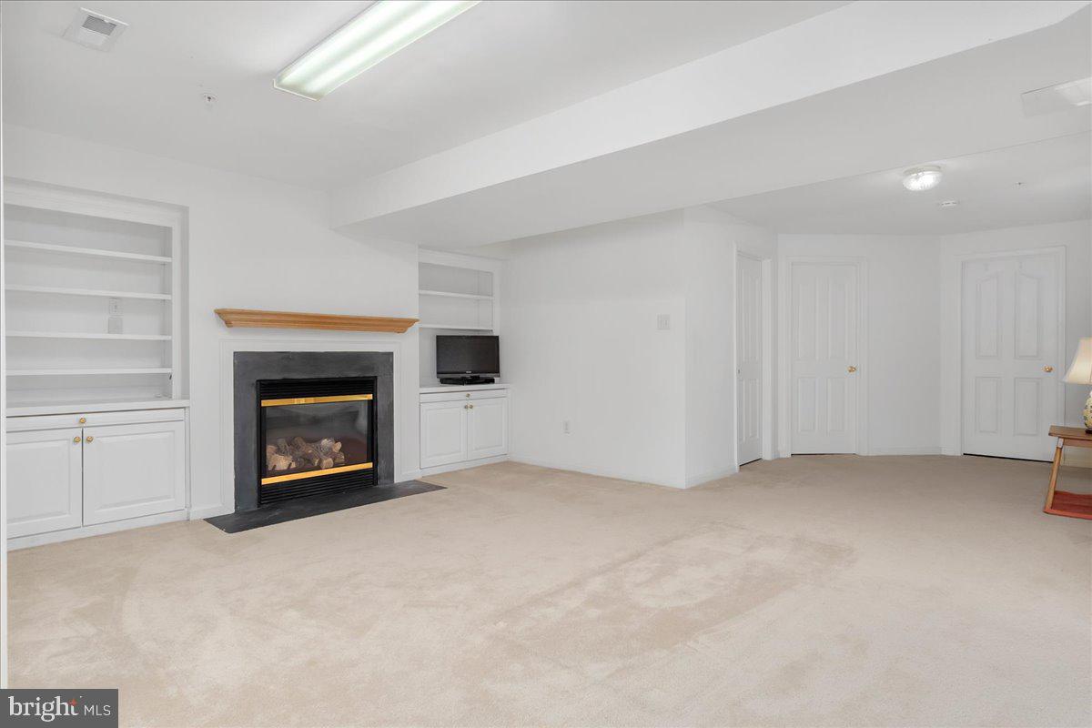2003 Buell Drive Frederick, MD 21702 - Photo 17 of 32 an empty room with a fireplace and window