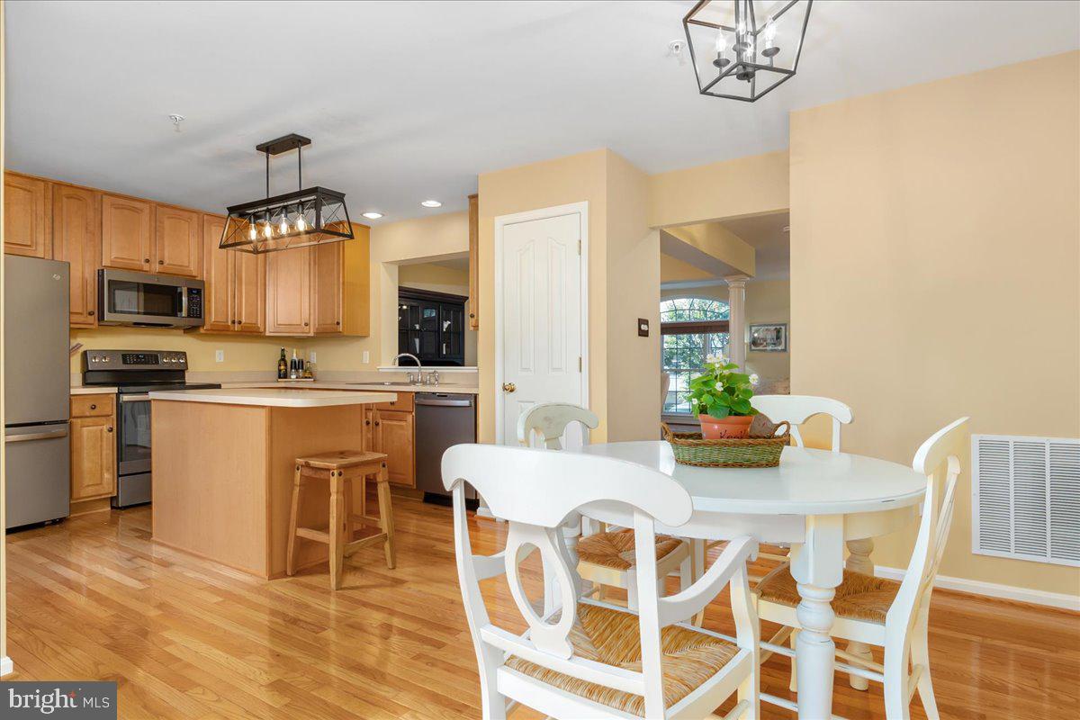 2003 Buell Drive Frederick, MD 21702 - Photo 5 of 32 a kitchen with granite countertop stainless steel appliances a sink and a refrigerator