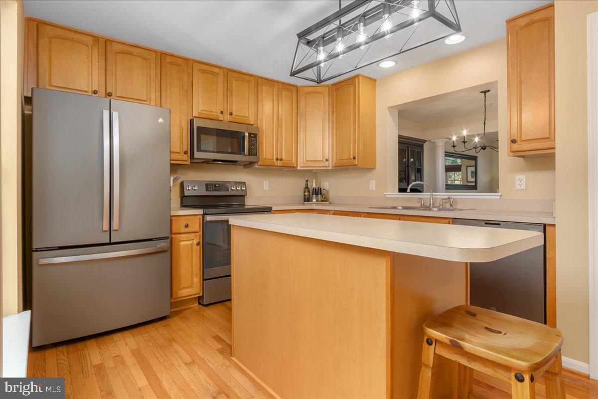 2003 Buell Drive Frederick, MD 21702 - Photo 7 of 32 a kitchen with stainless steel appliances a refrigerator stove and sink