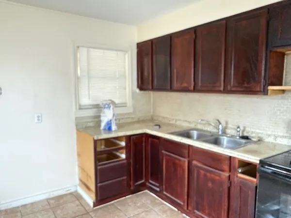 a kitchen with a sink and cabinets