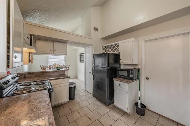 a kitchen with stainless steel appliances a refrigerator stove and sink