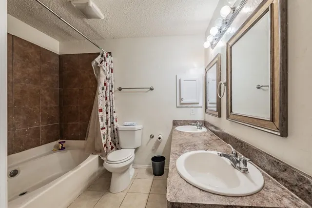 a bathroom with a sink a toilet and a bathtub