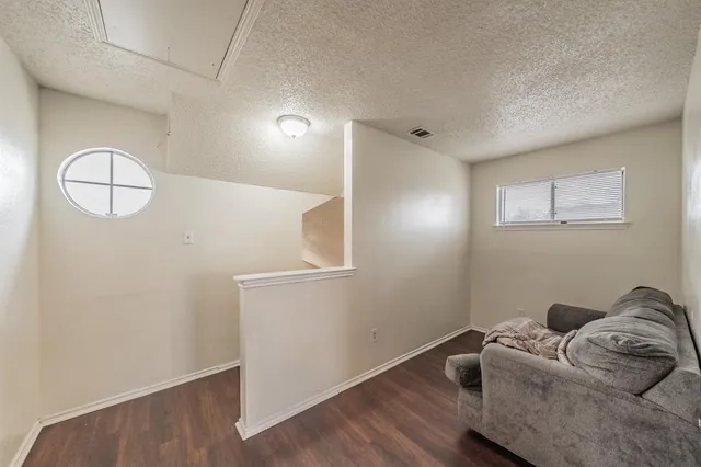 a view of room with wooden floor
