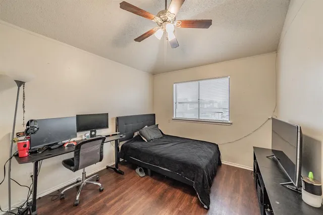 a bedroom with furniture and a window