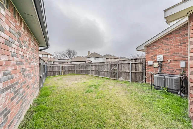 a view of a backyard with swimming pool
