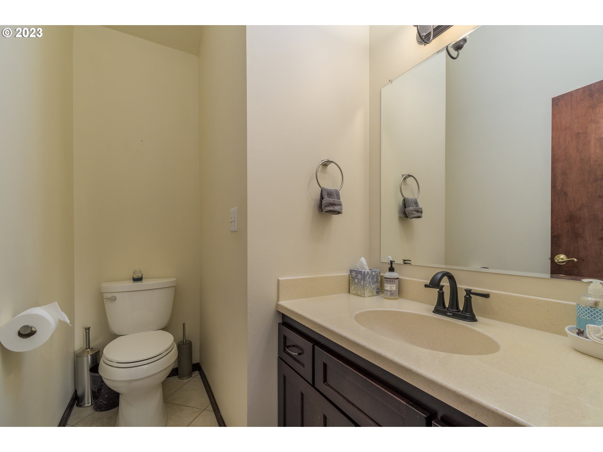39350 Eagles Rest Road Dexter, OR 97431 - Photo 14 of 42 a bathroom with a granite countertop toilet a sink and a mirror