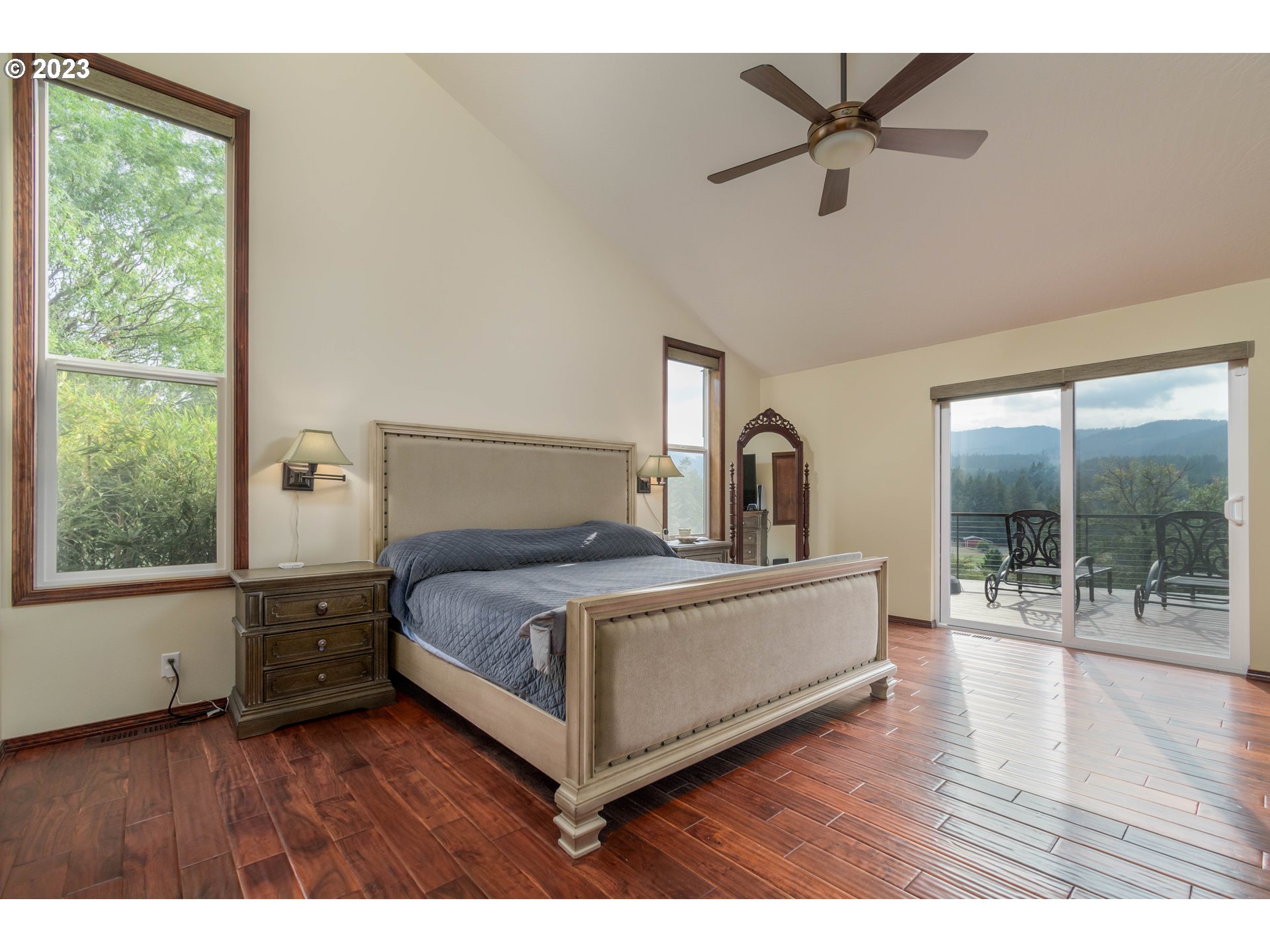 39350 Eagles Rest Road Dexter, OR 97431 - Photo 15 of 42 a bedroom with a bed and a large window with outer view