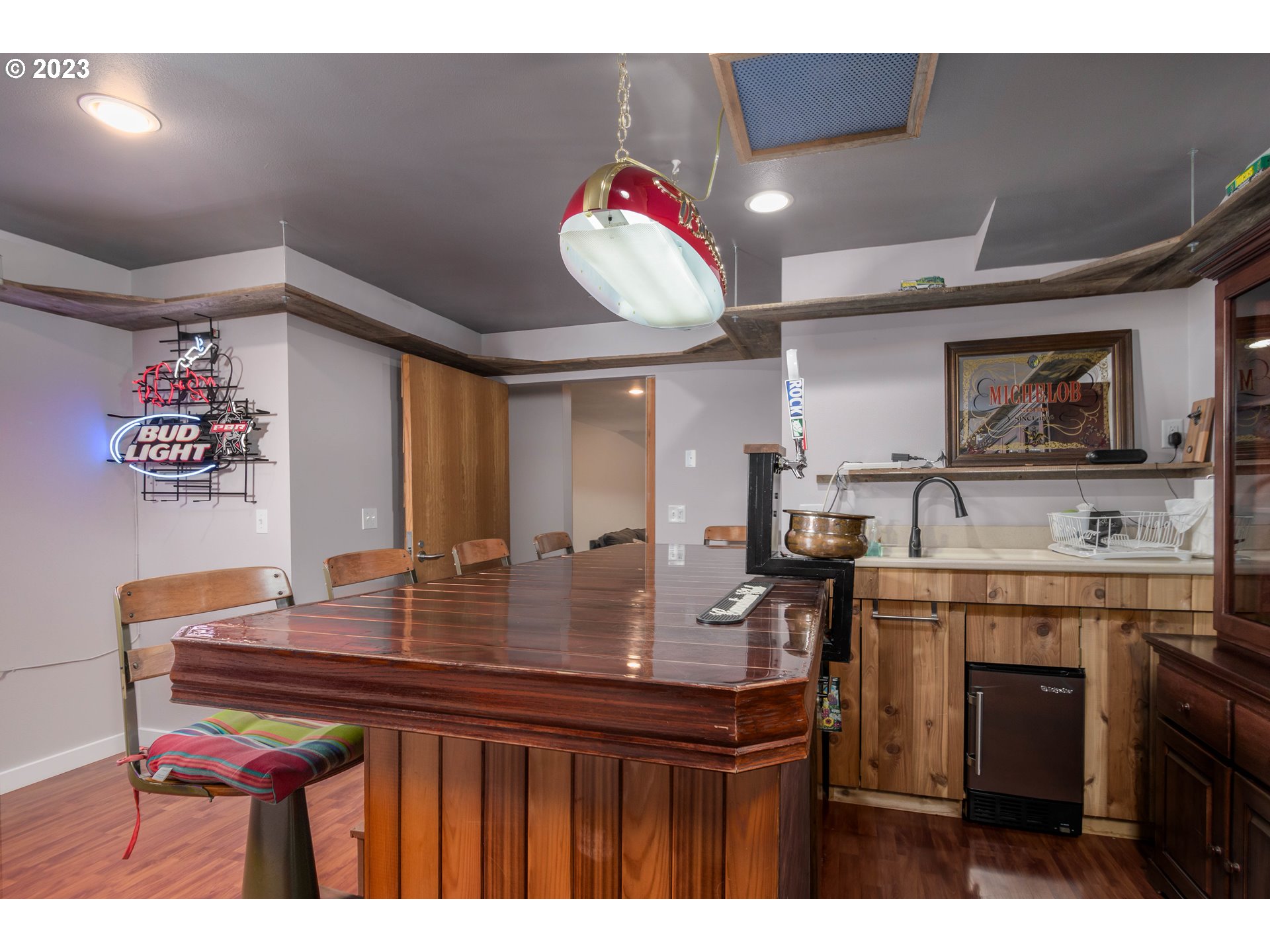 39350 Eagles Rest Road Dexter, OR 97431 - Photo 24 of 42 a kitchen with a sink cabinets and wooden floor