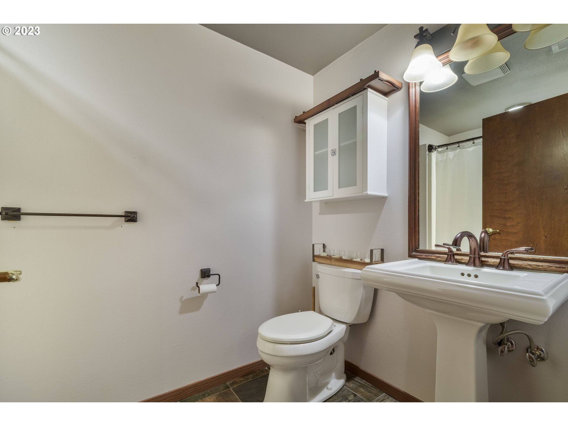 39350 Eagles Rest Road Dexter, OR 97431 - Photo 28 of 42 a bathroom with a sink mirror vanity and toilet