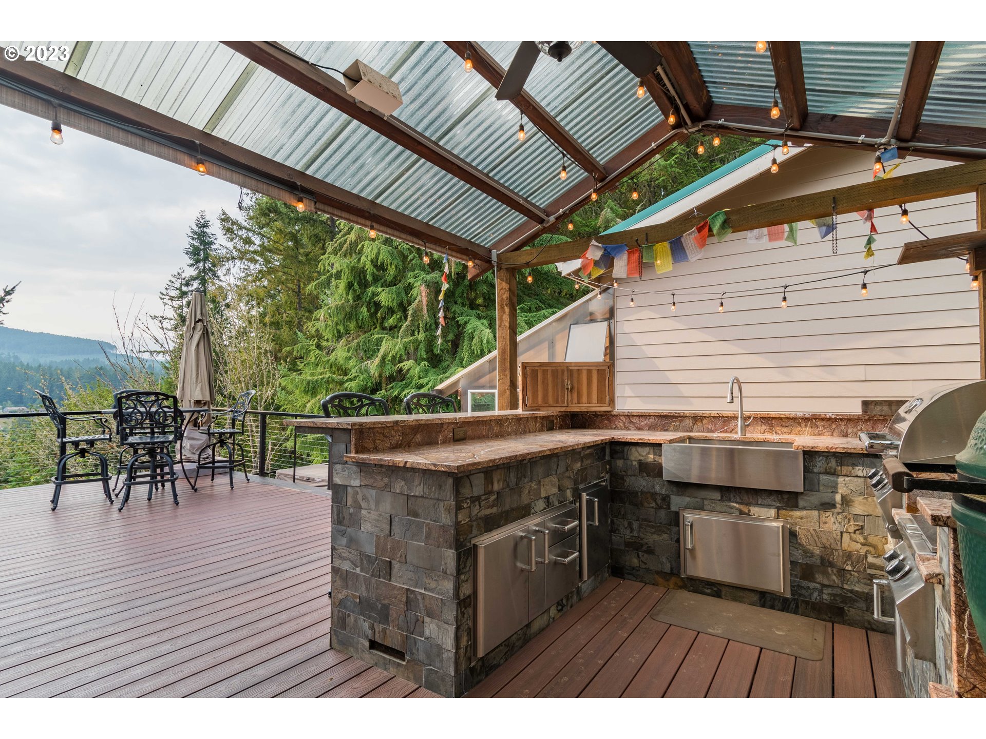 39350 Eagles Rest Road Dexter, OR 97431 - Photo 30 of 42 a view of a patio with table and chairs with wooden floor and fence
