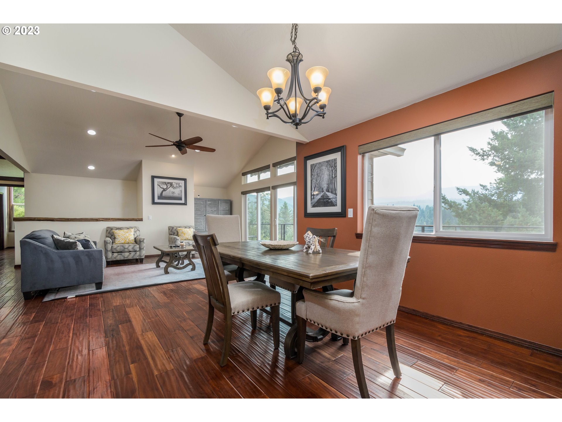 39350 Eagles Rest Road Dexter, OR 97431 - Photo 7 of 42 a view of a dining room with furniture a chandelier and wooden floor