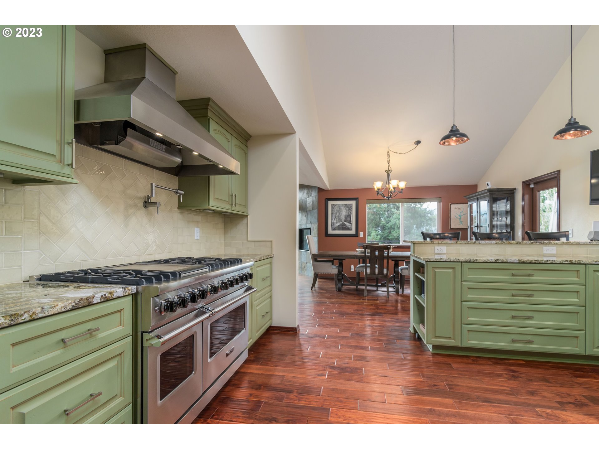 39350 Eagles Rest Road Dexter, OR 97431 - Photo 9 of 42 a kitchen with a stove a sink and a wooden cabinets