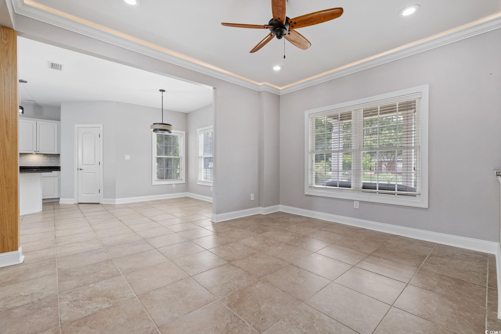 11569 Bay Drive Little River, SC 29566 - Photo 12 of 40 Spare room with ornamental molding, a ceiling fan, light tile patterned floors, and recessed lighting