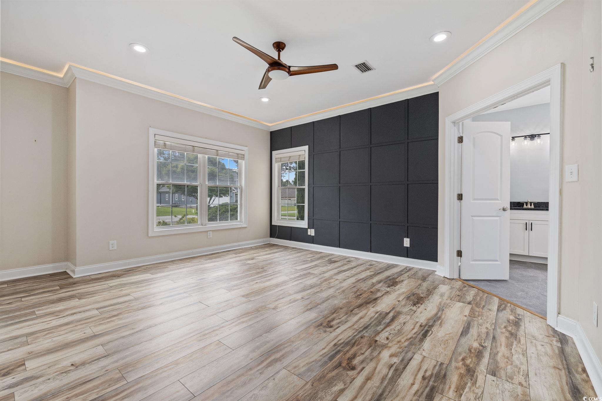 11569 Bay Drive Little River, SC 29566 - Photo 14 of 40 Empty room with ornamental molding, a ceiling fan, light wood-type flooring, and recessed lighting