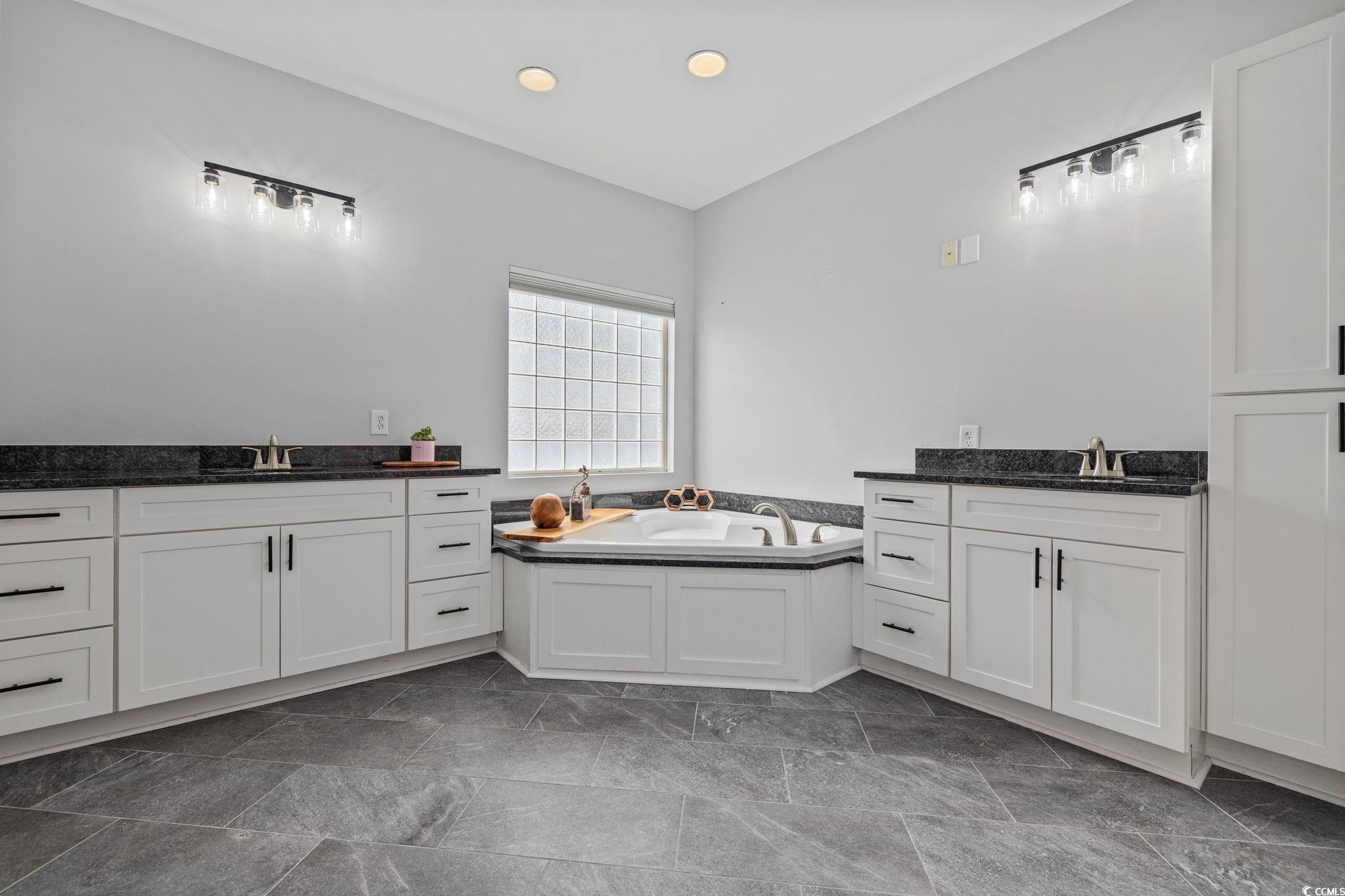 11569 Bay Drive Little River, SC 29566 - Photo 16 of 40 Bathroom with a garden tub and two vanities