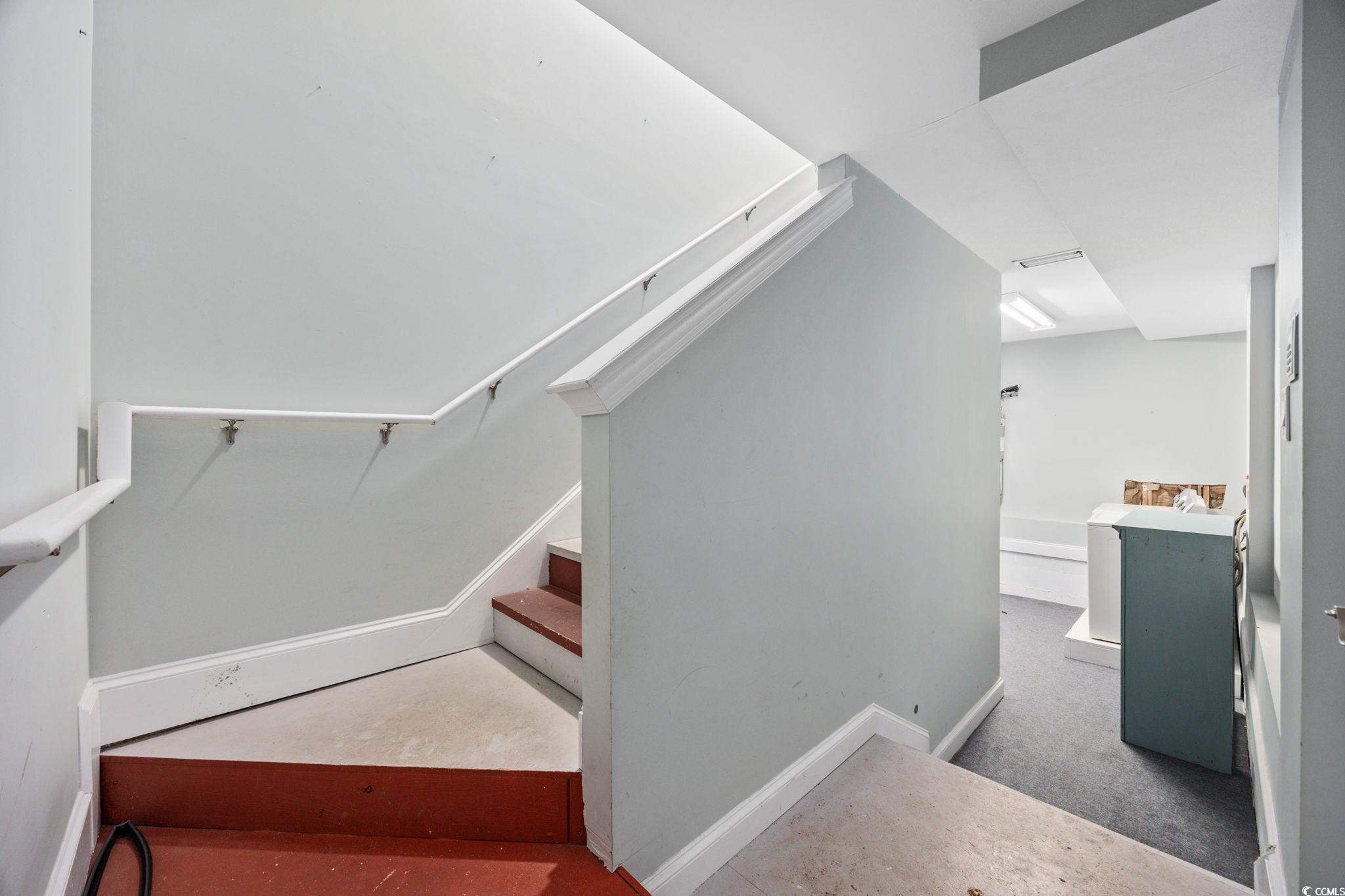11569 Bay Drive Little River, SC 29566 - Photo 27 of 40 Staircase featuring baseboards and carpet floors