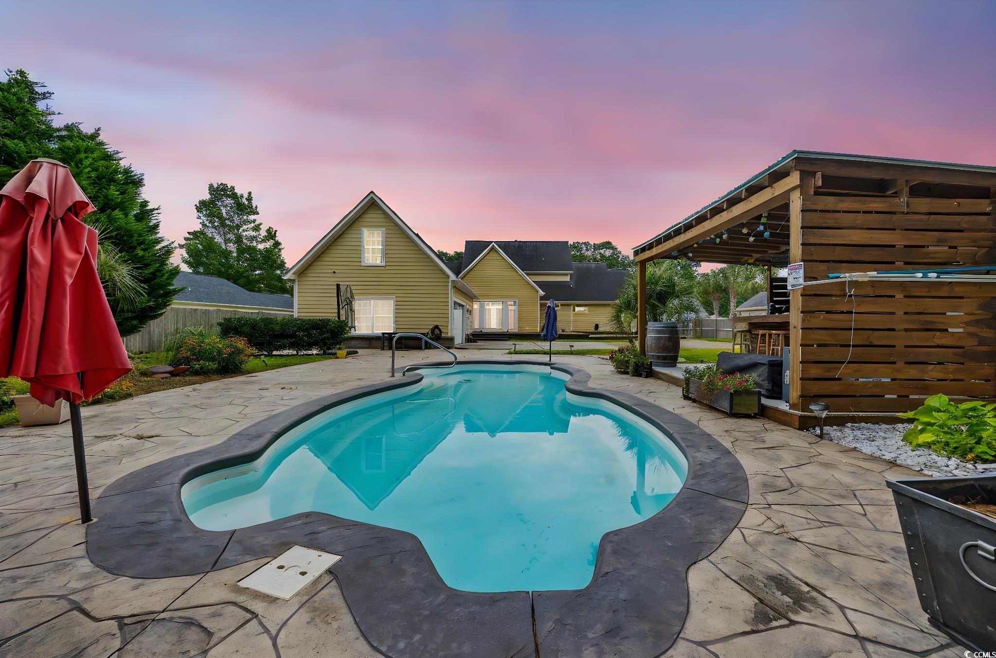 11569 Bay Drive Little River, SC 29566 - Photo 35 of 40 View of swimming pool featuring a patio