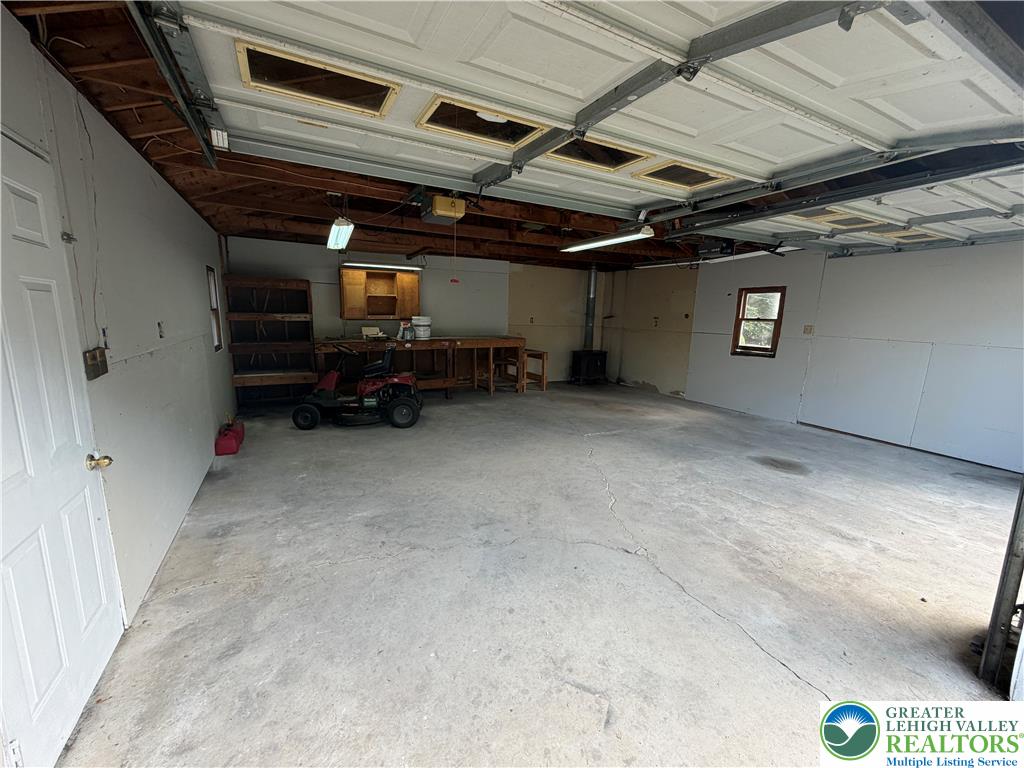 5720 Memorial Road Germansville, PA 18053 - Photo 23 of 29 A spacious garage with ample room for vehicles and a dedicated workbench area for projects.