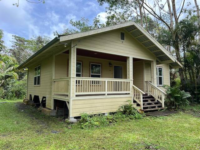 14-823 Seaview Road Pahoa, HI 96778 - Photo 13 of 17 a house with trees in the background