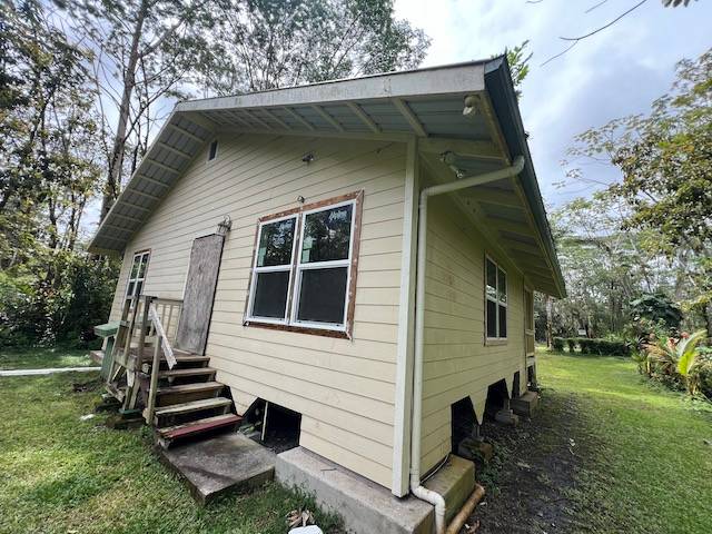 14-823 Seaview Road Pahoa, HI 96778 - Photo 15 of 17 a front view of a house with a yard