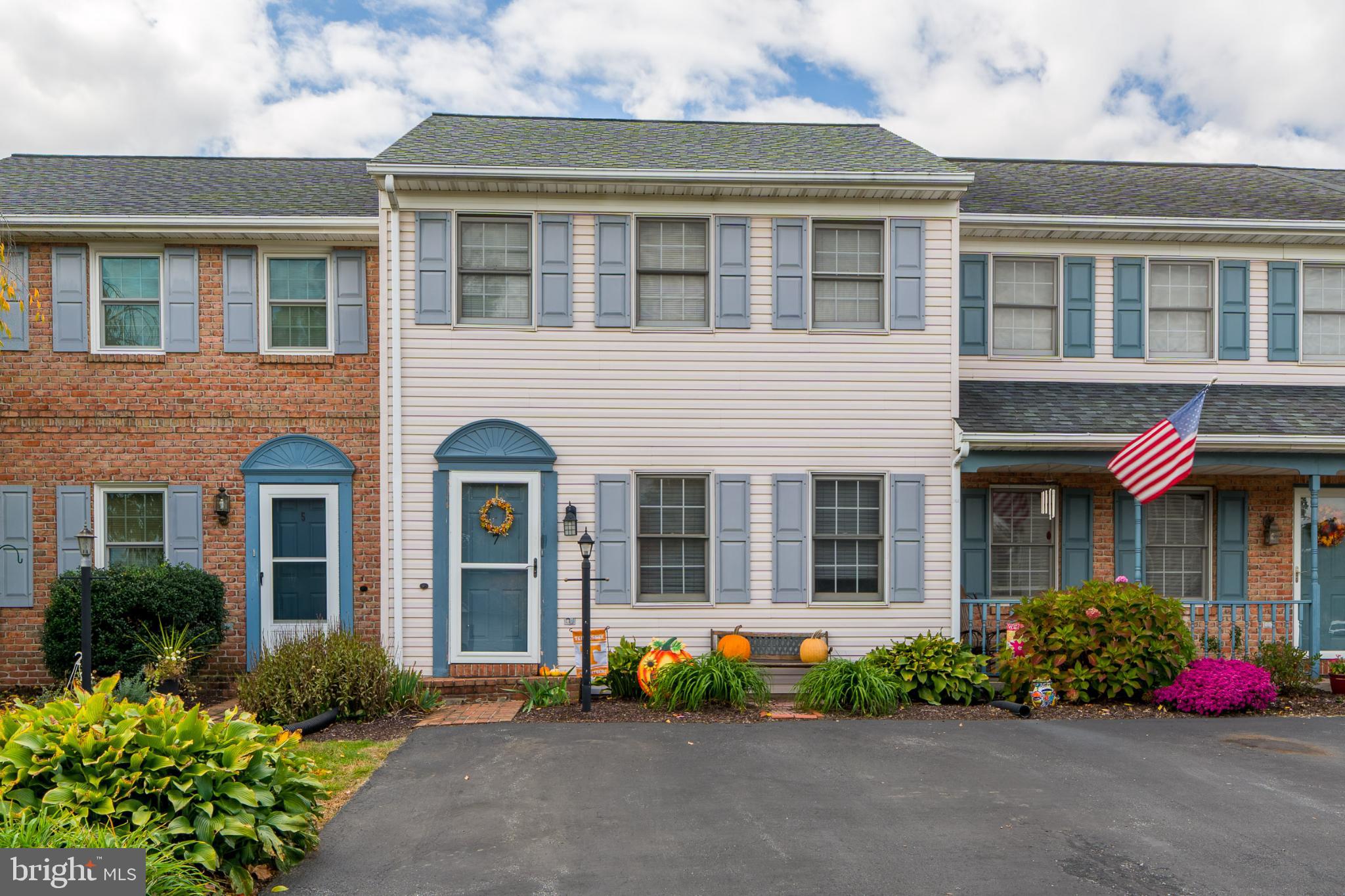 7 Brookfield Road Lititz, PA 17543 - Photo 1 of 28 a front view of a house with a yard and potted plants