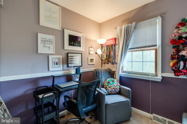 a view of a workspace with furniture