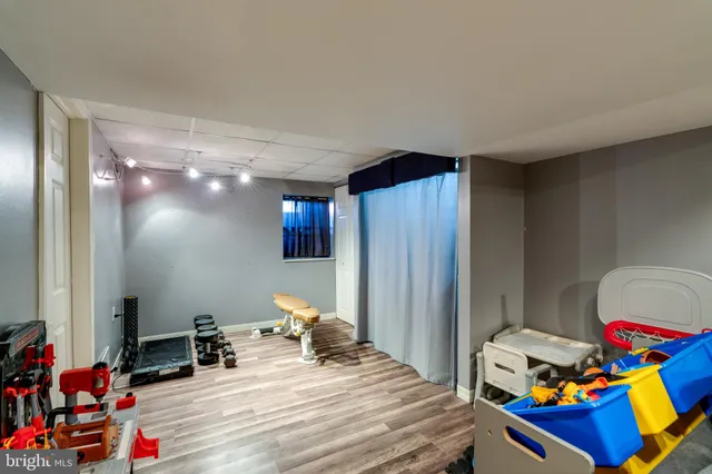 a bedroom with bed and a mirror