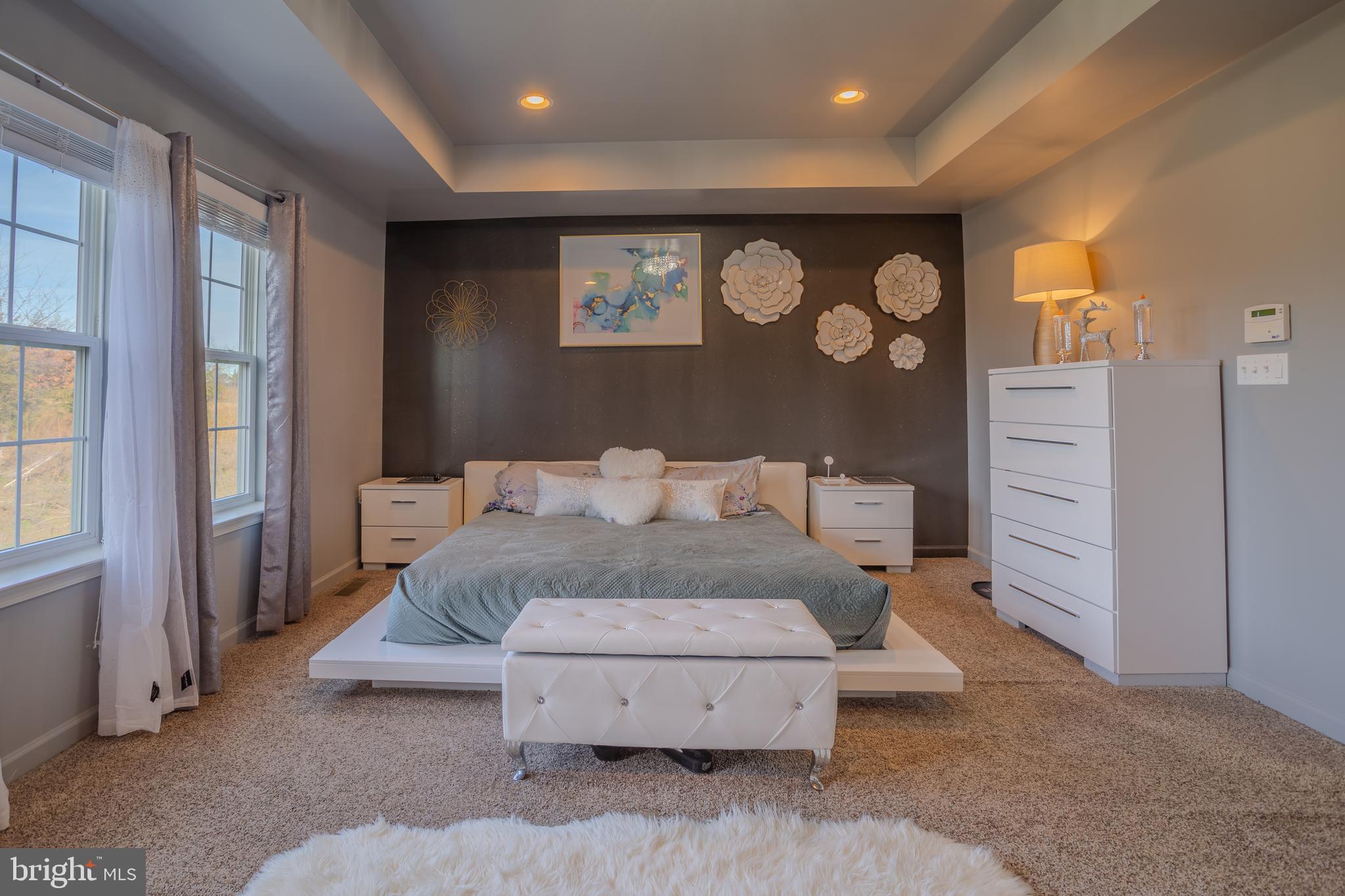 35 Landis Court Falling Waters, WV 25419 - Photo 26 of 64 a spacious bedroom with a bed and a large window