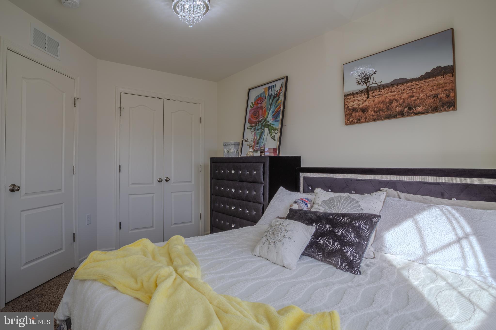 35 Landis Court Falling Waters, WV 25419 - Photo 34 of 64 a bedroom with a bed and a painting on the wall