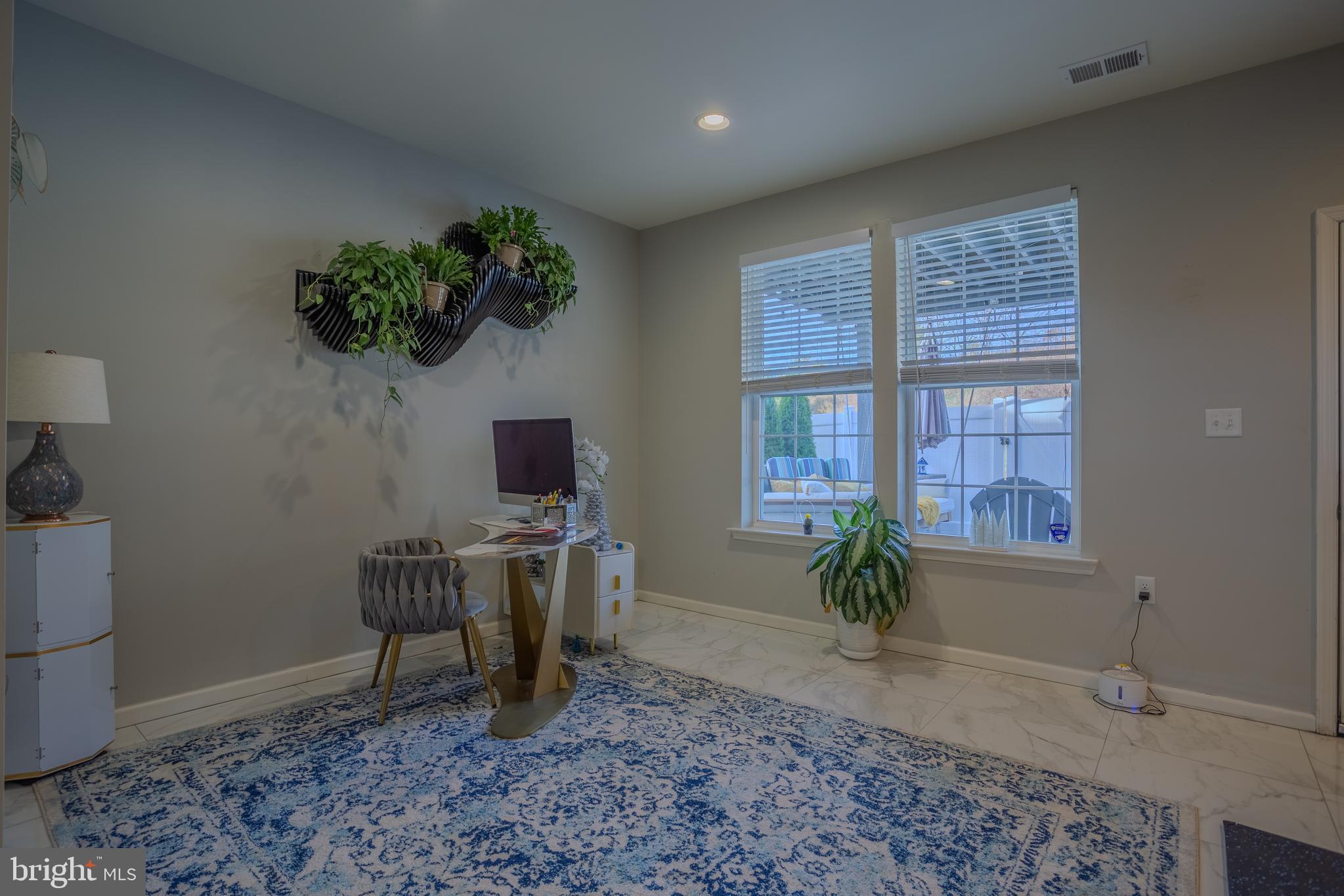 35 Landis Court Falling Waters, WV 25419 - Photo 47 of 64 a living room with furniture and a potted plant