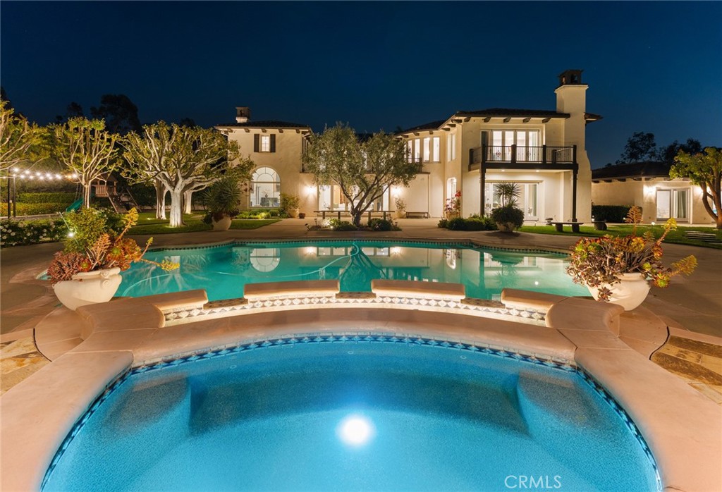 a view of a swimming pool and outdoor seating