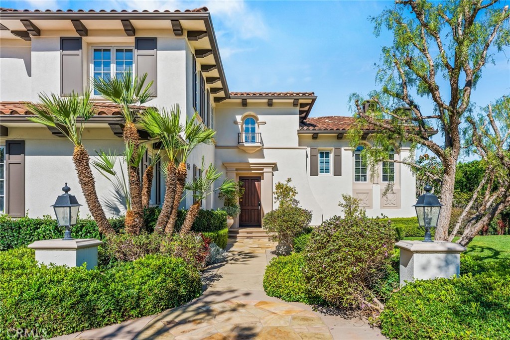 11765 Riehl Avenue Tustin, CA 92782 - Photo 11 of 53 front view of a house with potted plants