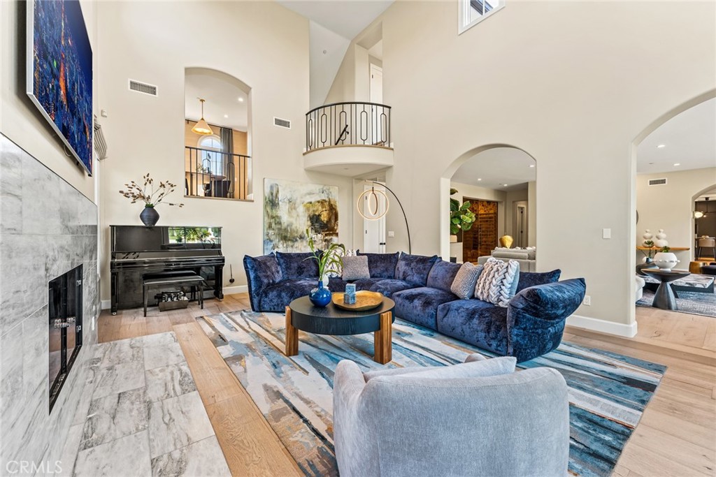 11765 Riehl Avenue Tustin, CA 92782 - Photo 14 of 53 a living room with furniture and a fireplace