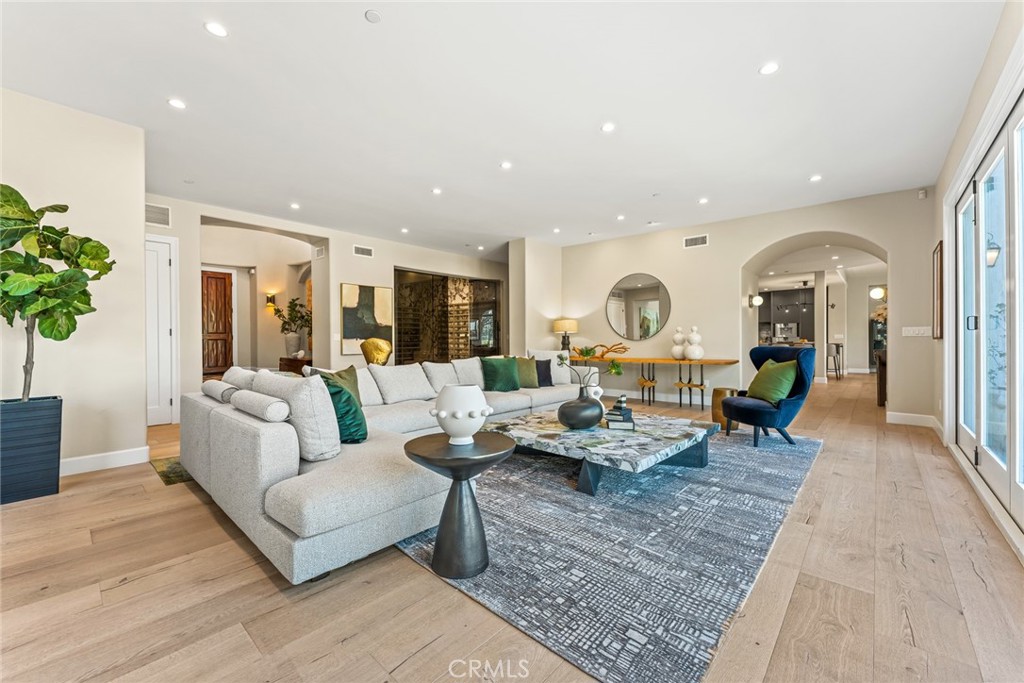 11765 Riehl Avenue Tustin, CA 92782 - Photo 16 of 53 a living room with furniture fireplace and wooden floor